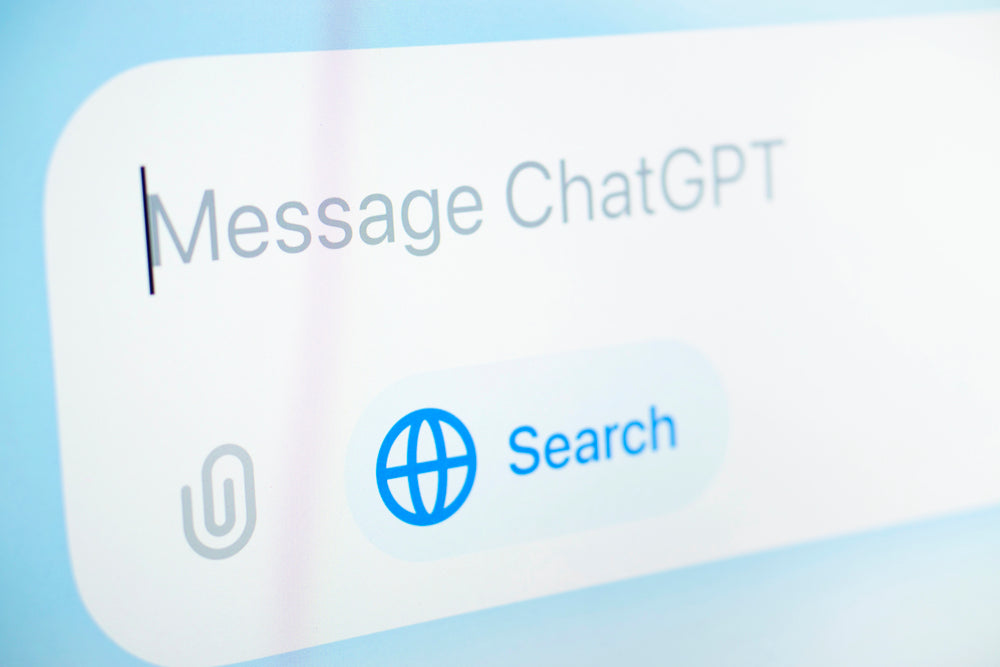 Chat input field labeled "Message ChatGPT" with a globe Search button displayed on a light-colored app interface.